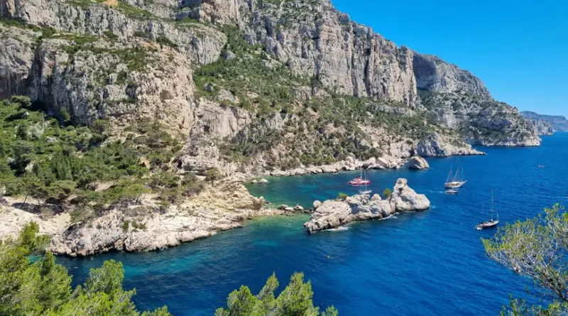 Explore the breathtaking cliffs and azure waters of Calanques National Park in Marseille, France.