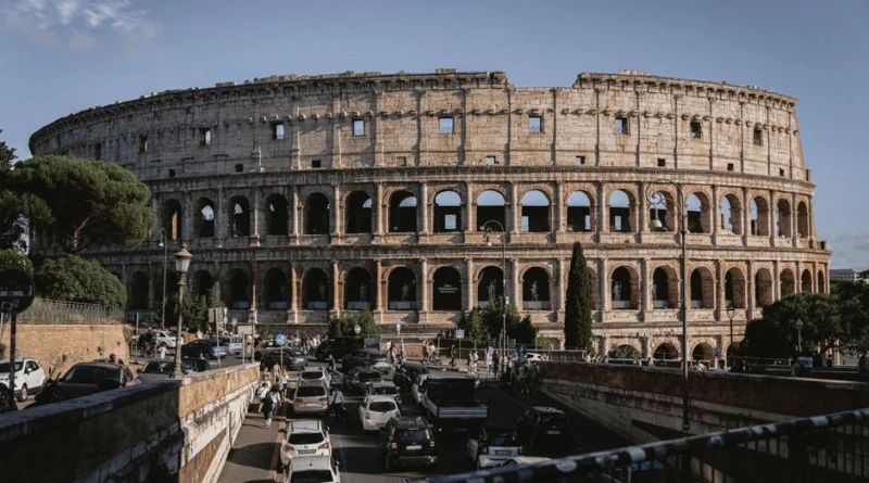 The Colosseum stands majestically amidst bustling Rome, an iconic remnant of ancient architecture.