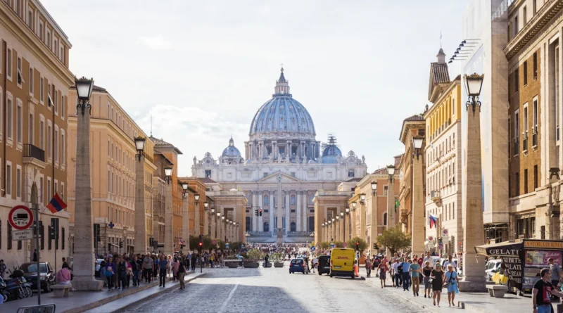 people walking beside white and brown dome building during daytime