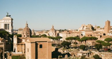 Explore the historic Roman Forum in Lazio, Italy, showcasing ancient architecture under a clear blue sky.